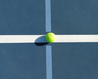 A line judge attentively watching the ball during a crucial point in the game.
