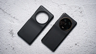 Two angled shots of the Voltek case highlighting its premium materials and camera protection.