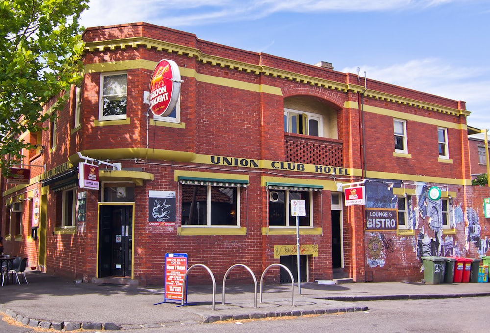 a red brick building with a sign on the front of it