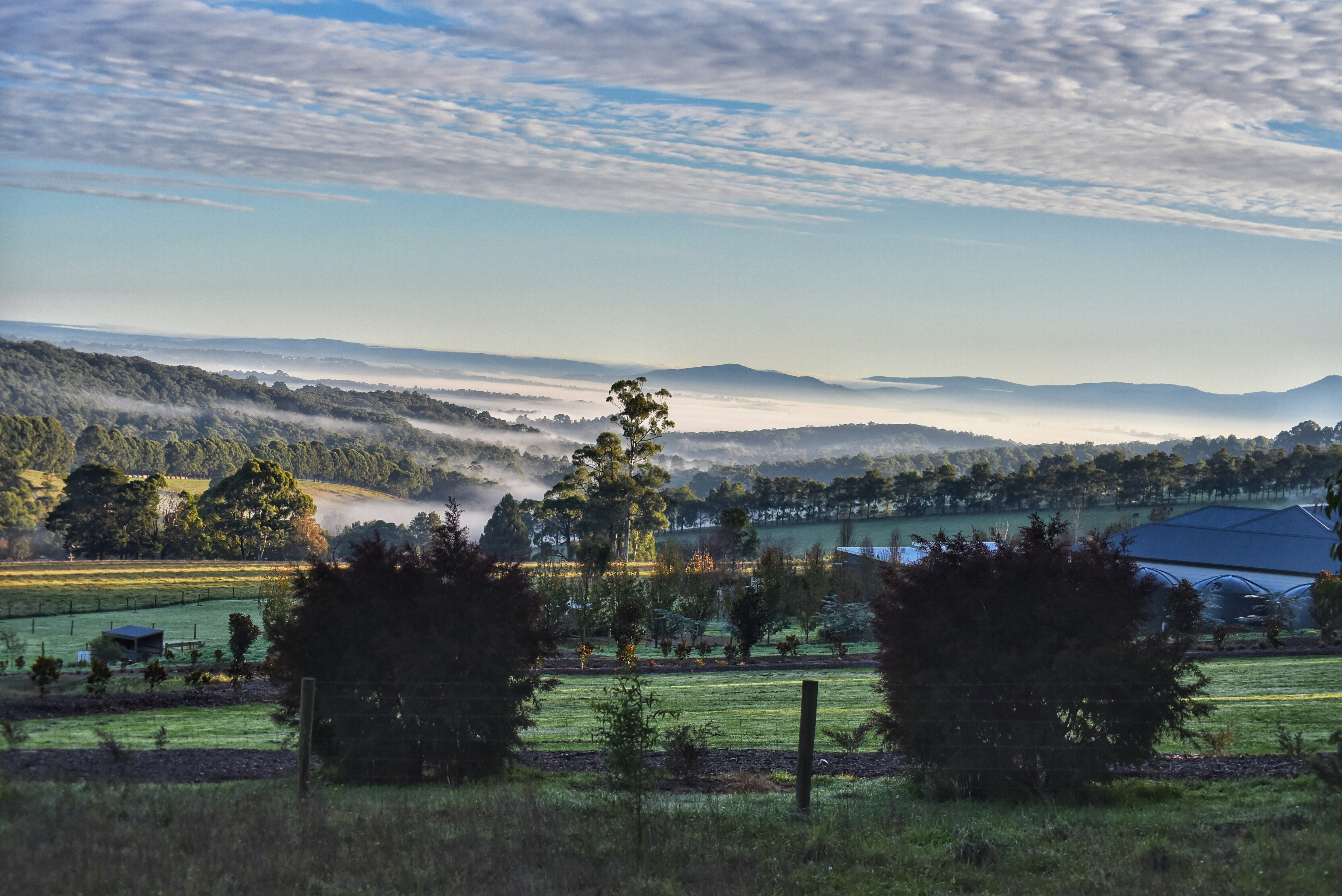 A scenic view of a farm in the mountains photo – Free Green Image on ...