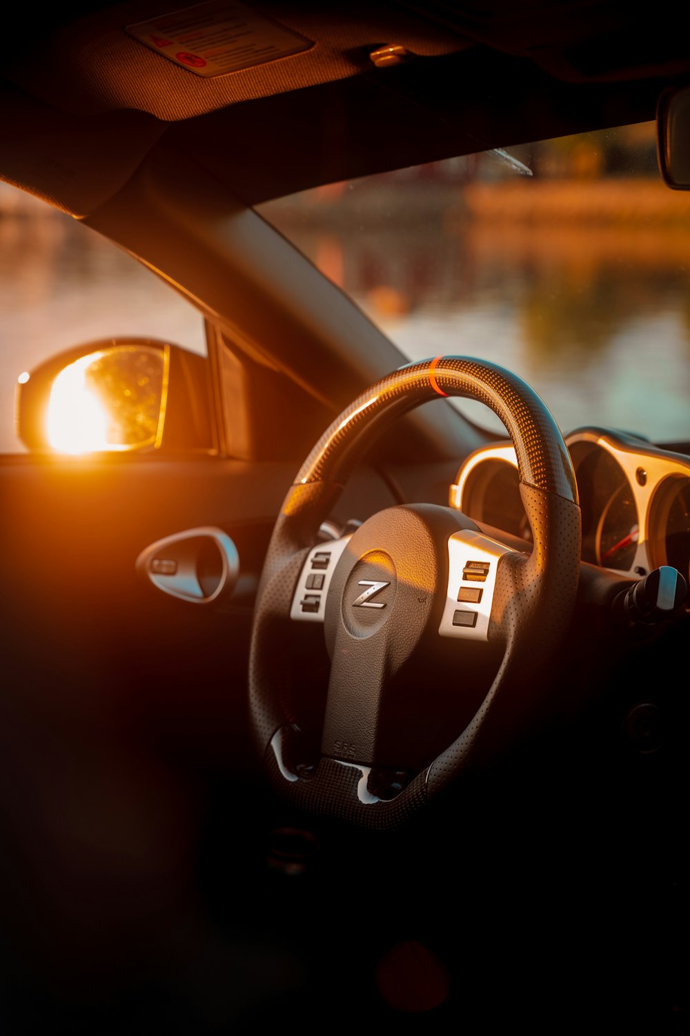 the interior of a car with the sun shining through the windshield