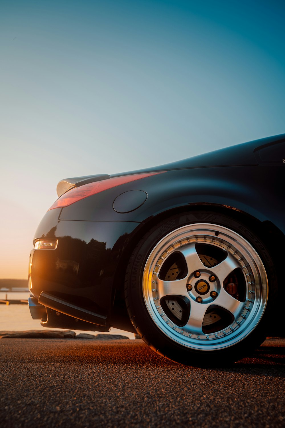 a black sports car parked on the side of the road