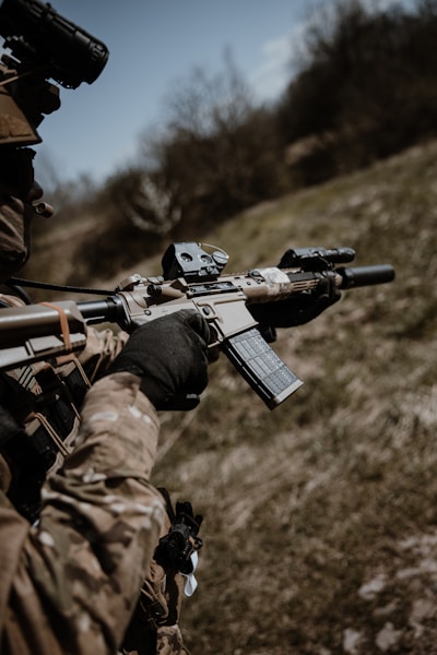 a man holding a rifle in his hand