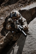 a soldier with a machine gun in his hand