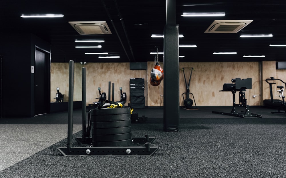 a gym filled with machines and equipment