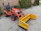 Image of a construction site with a bright orange tractor supplied by Tractoro in action.