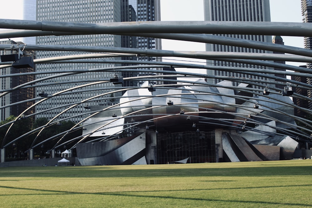 a large metal structure in the middle of a park