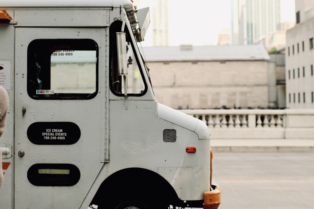 a man standing in front of a food truck