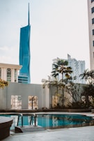 Swimming pool area surrounded by smooth, stamped concrete decking.