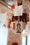 a bunch of pictures hanging from a ceiling