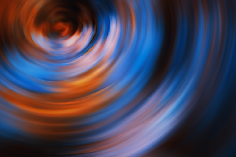 a blurry image of an orange and blue swirl