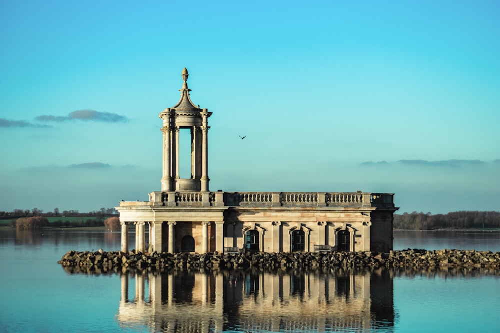 a large building sitting on top of a body of water