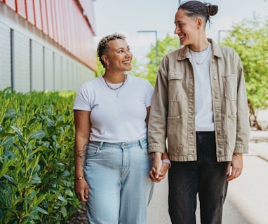 Portrait of nonbinary autistic person with their wife outdoors