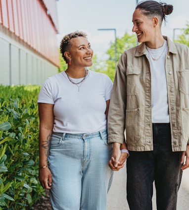 Portrait of nonbinary autistic person with their wife outdoors