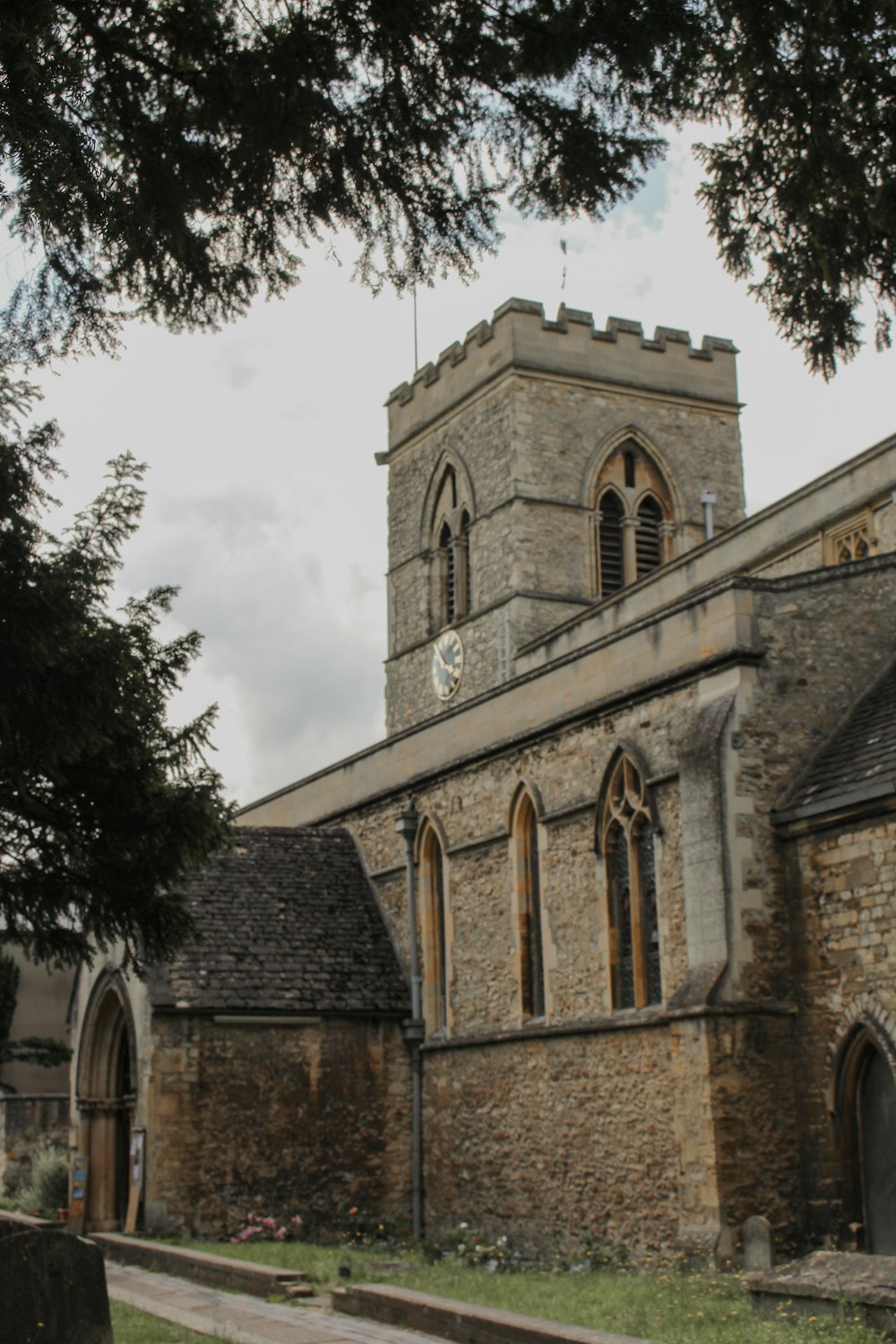 an old church with a steeple and a clock tower