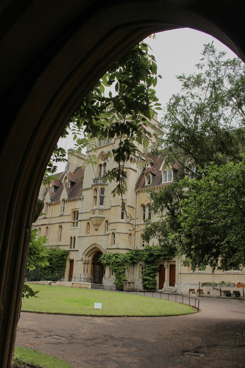 a view of a large building through an arch