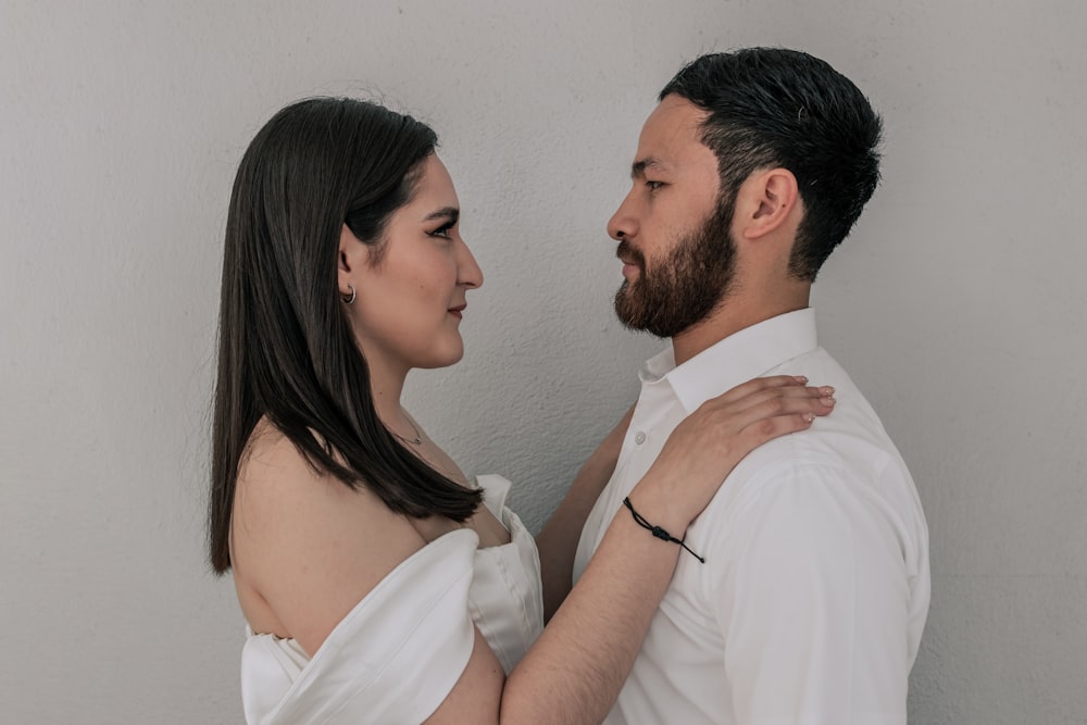 a man and a woman standing next to each other