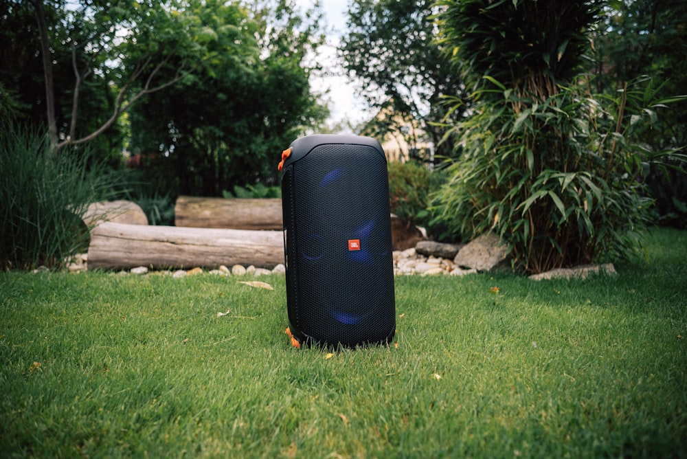 a suitcase sitting in the middle of the grass