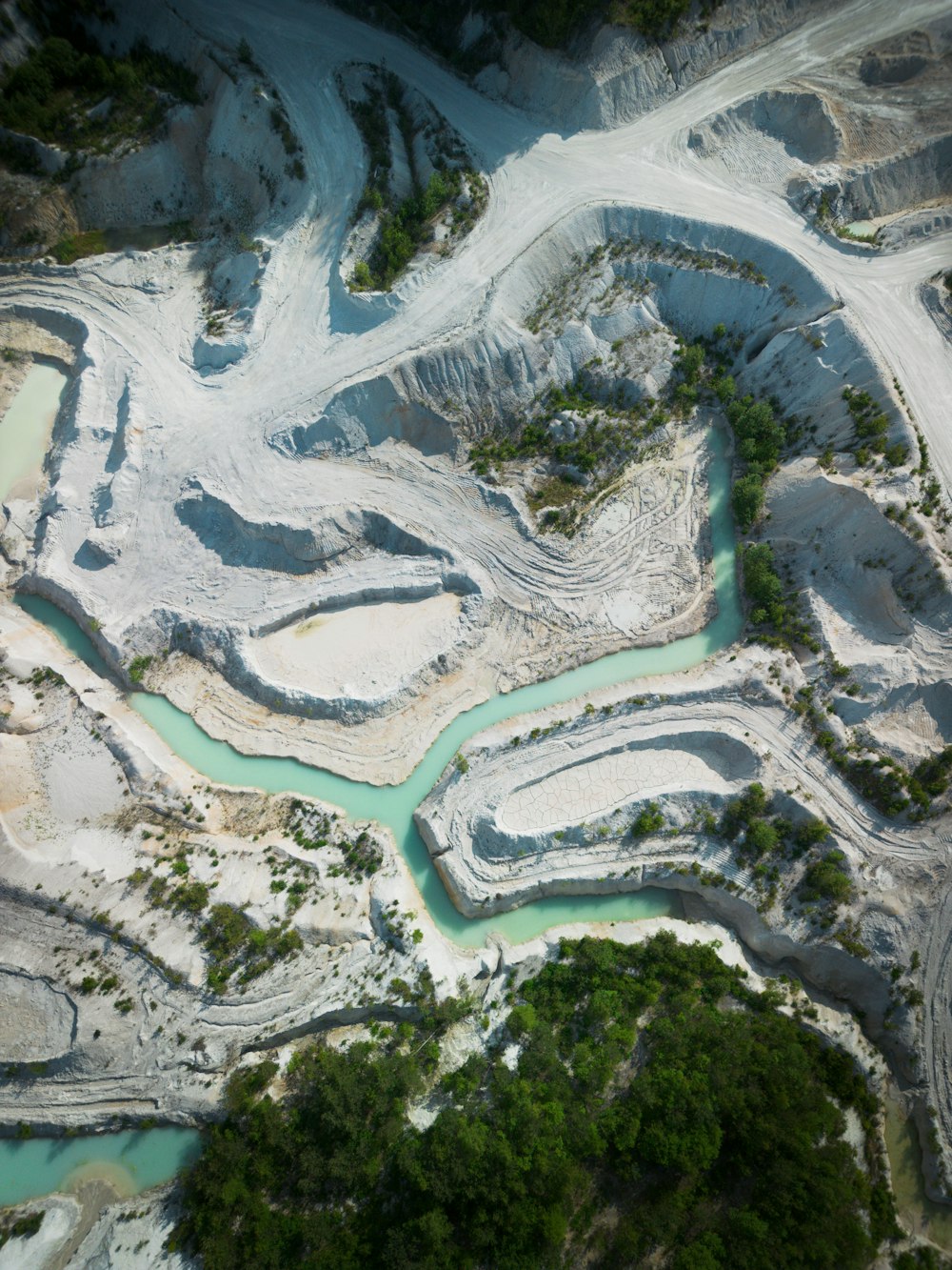 an aerial view of a river and a quarry