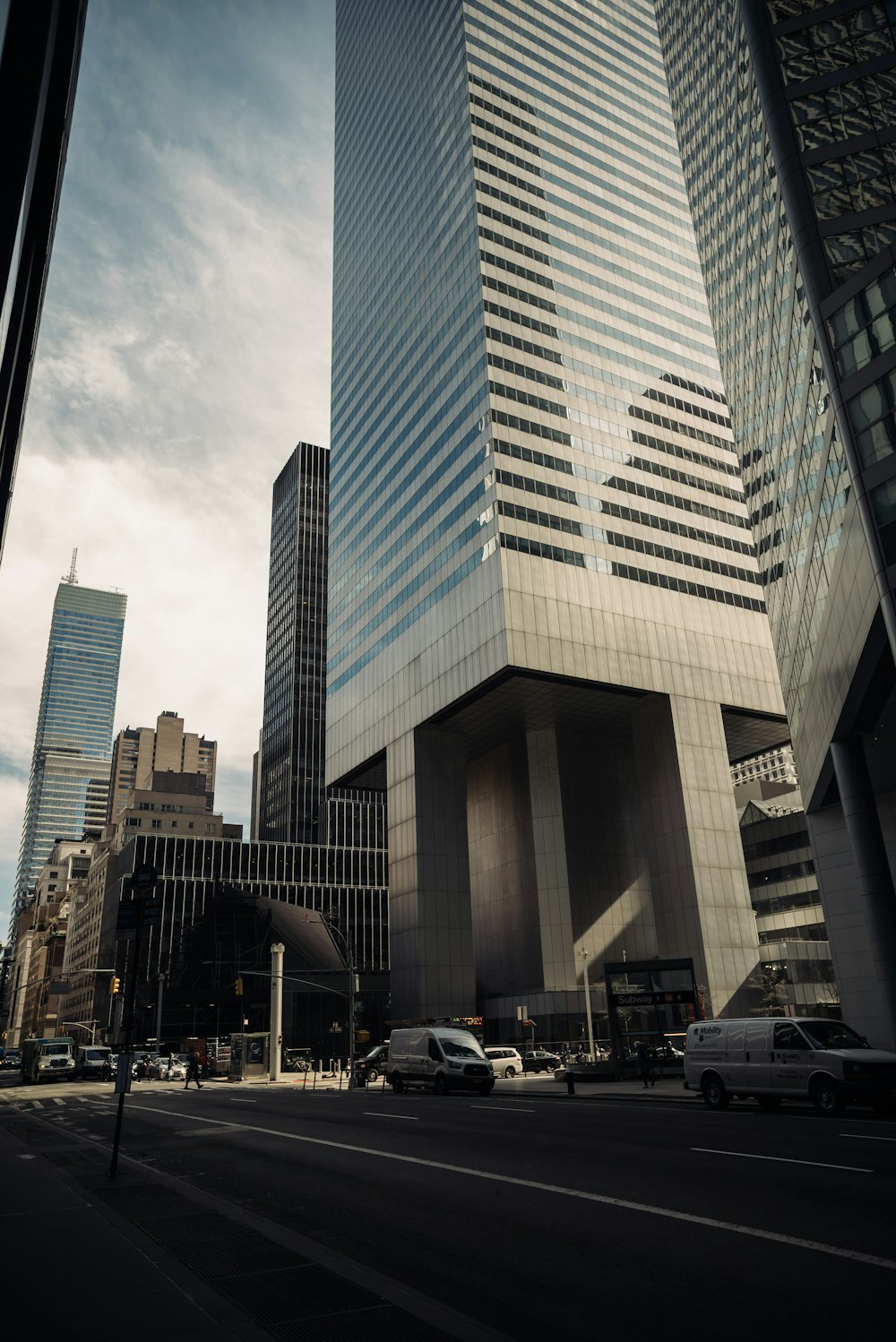 a city street filled with lots of tall buildings