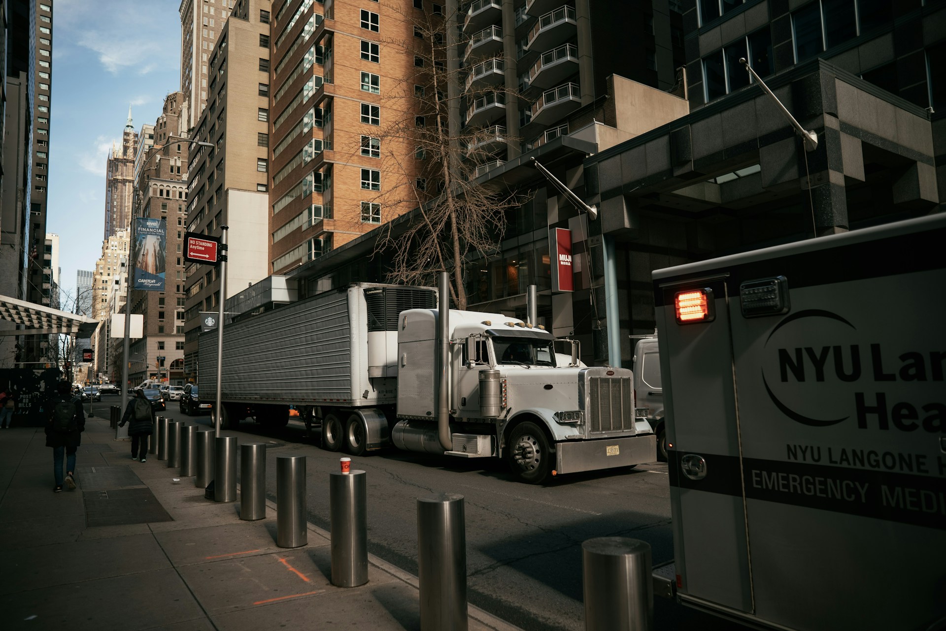 a large truck is parked on the side of the street