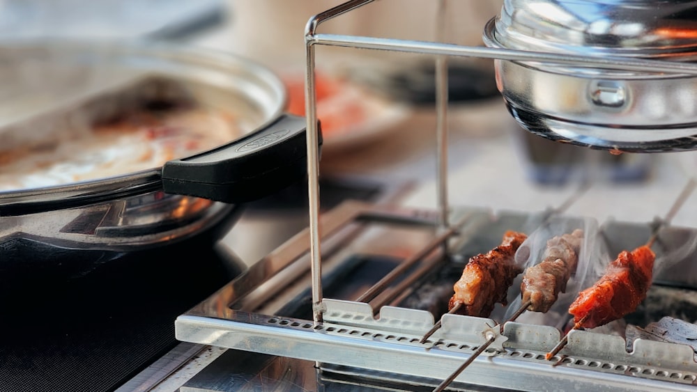 a bunch of food is being cooked on a grill