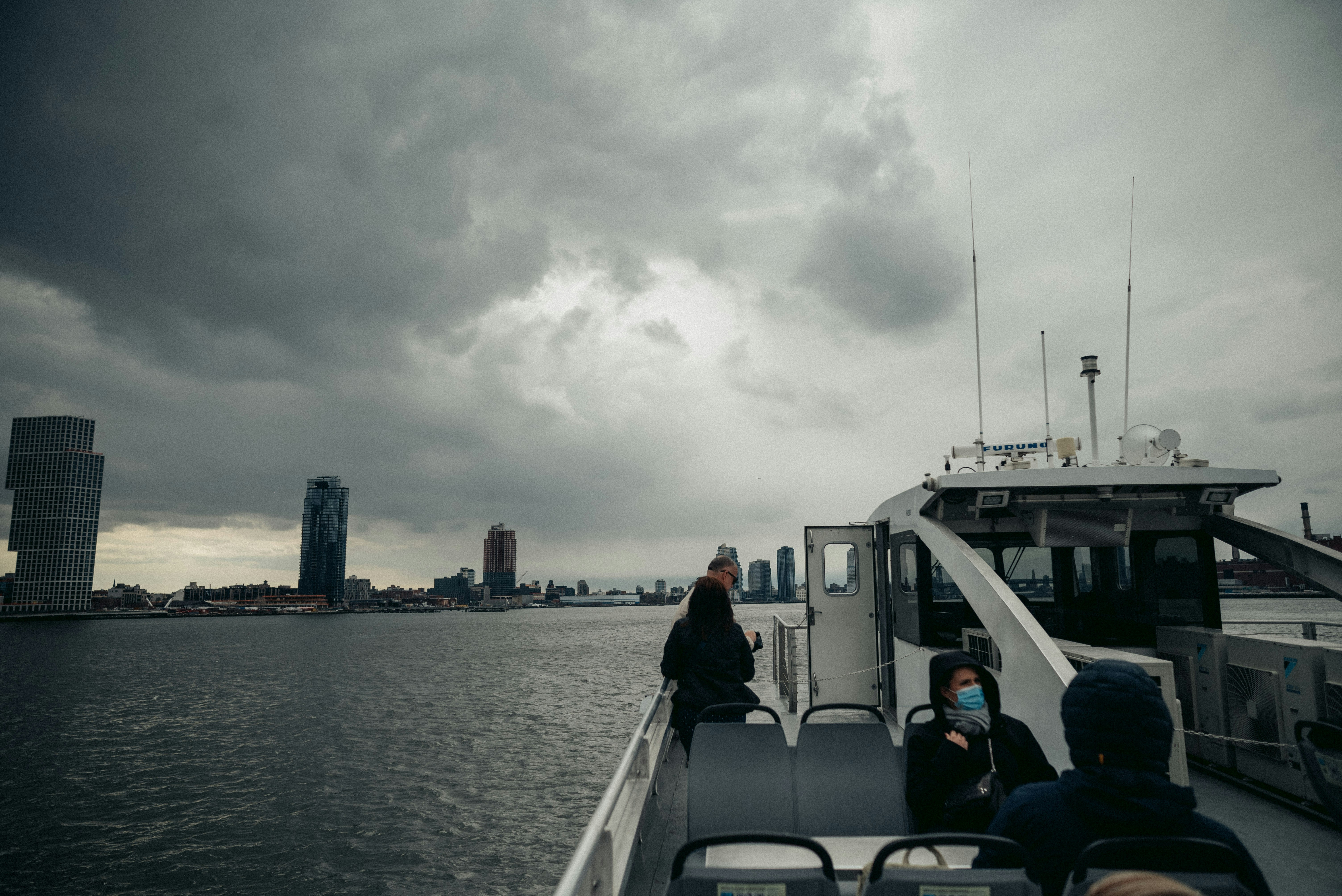 A group of people on a boat in the water photo – Free City Image on ...
