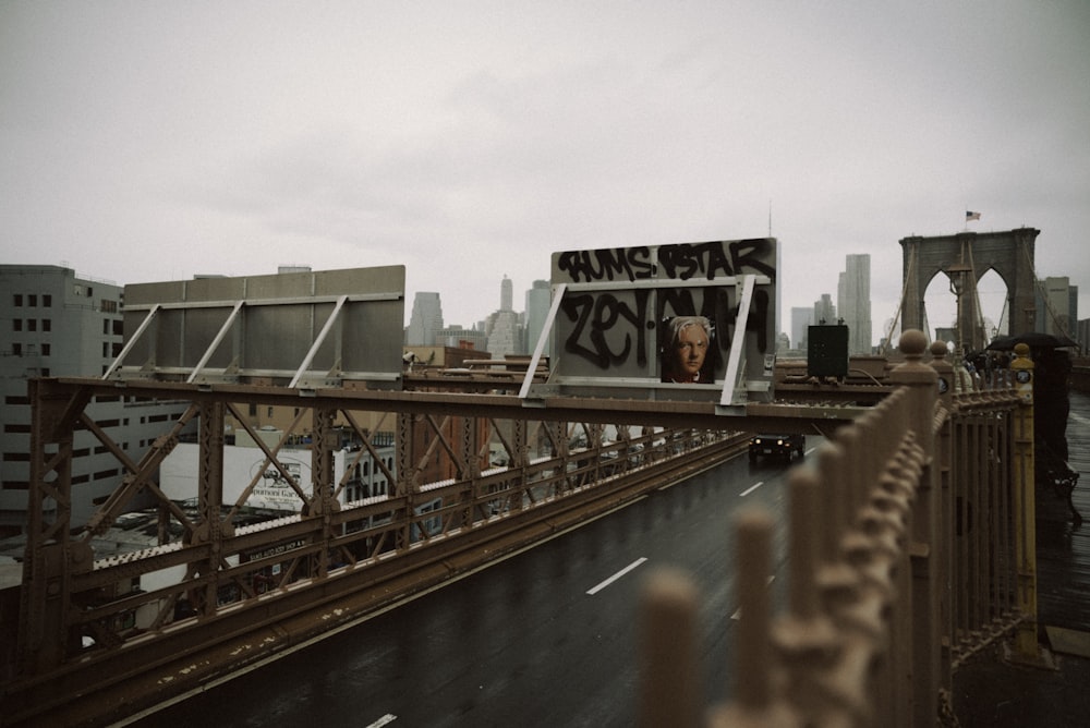 a sign on the side of a bridge that reads king of the road