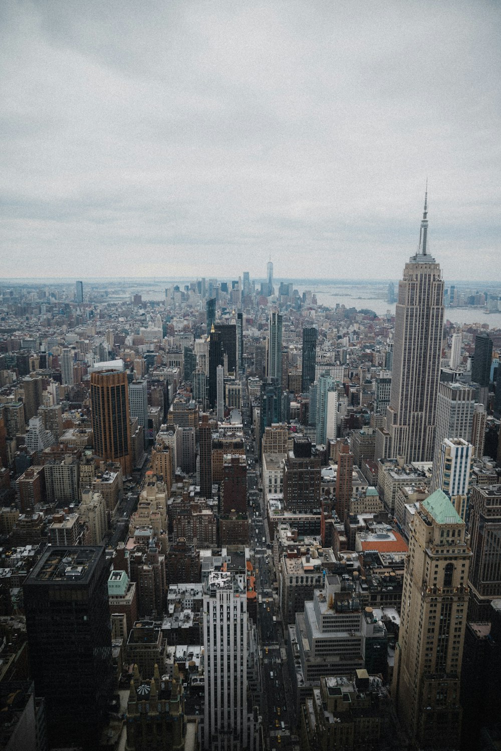 an aerial view of a city with tall buildings