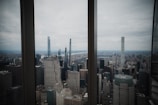 A city skyline viewed from an office window symbolizing growth and opportunity.