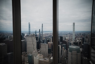 City skyline viewed from an office window symbolizing global reach.