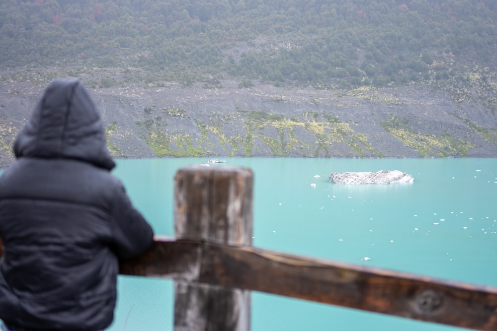 a person looking out over a body of water