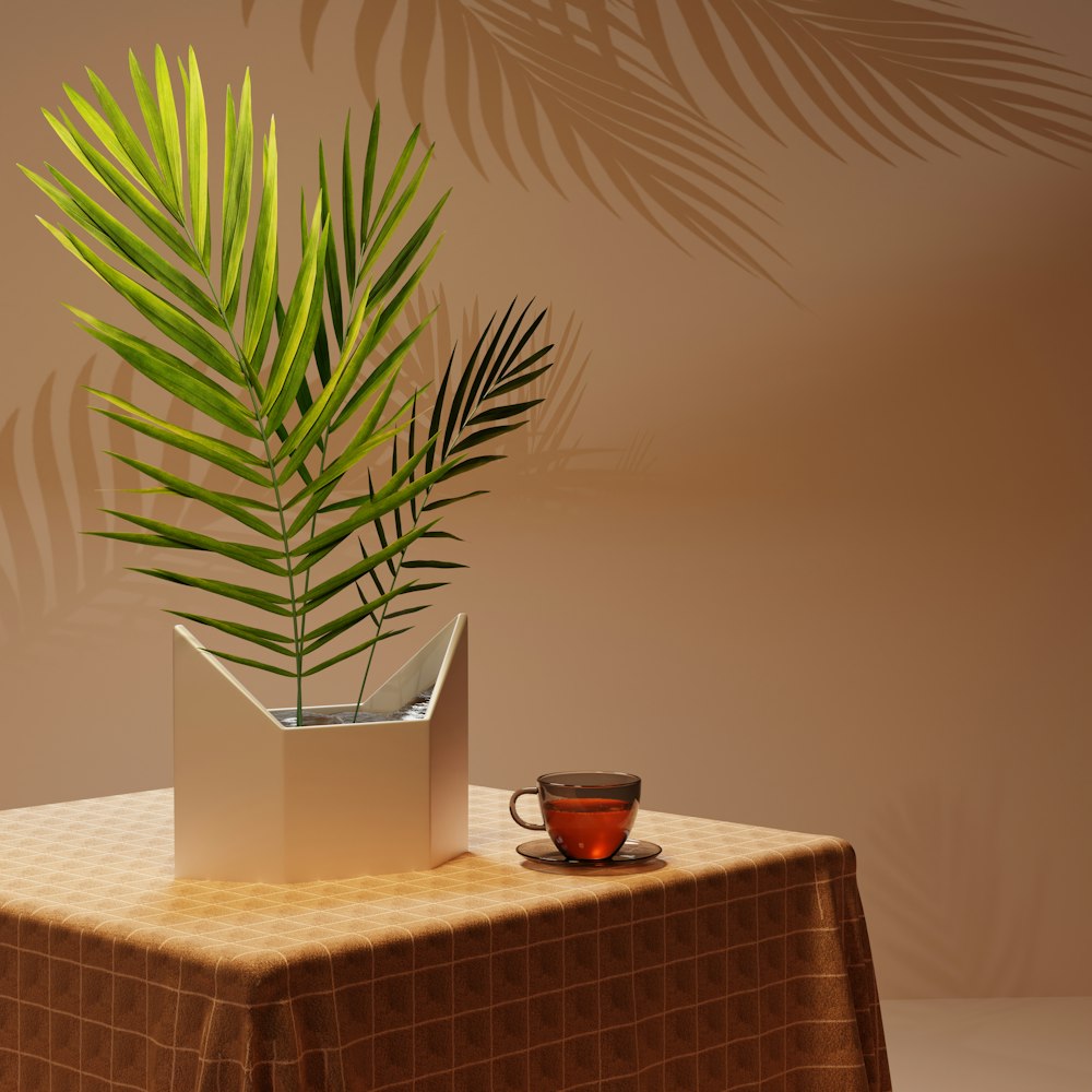 una mesa con una planta y una taza