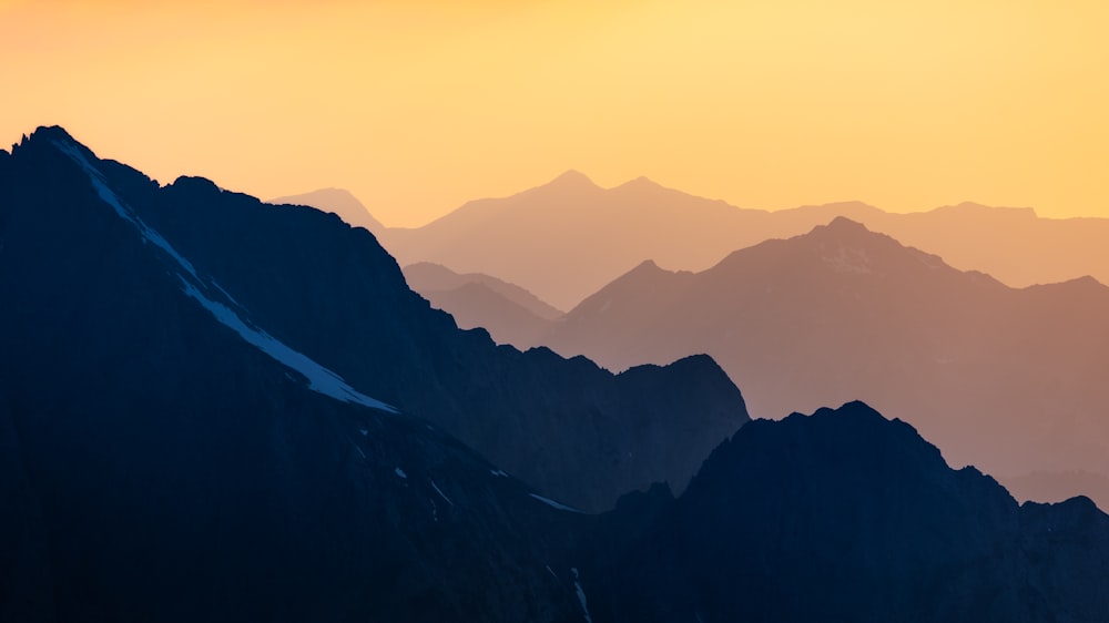 a view of a mountain range at sunset