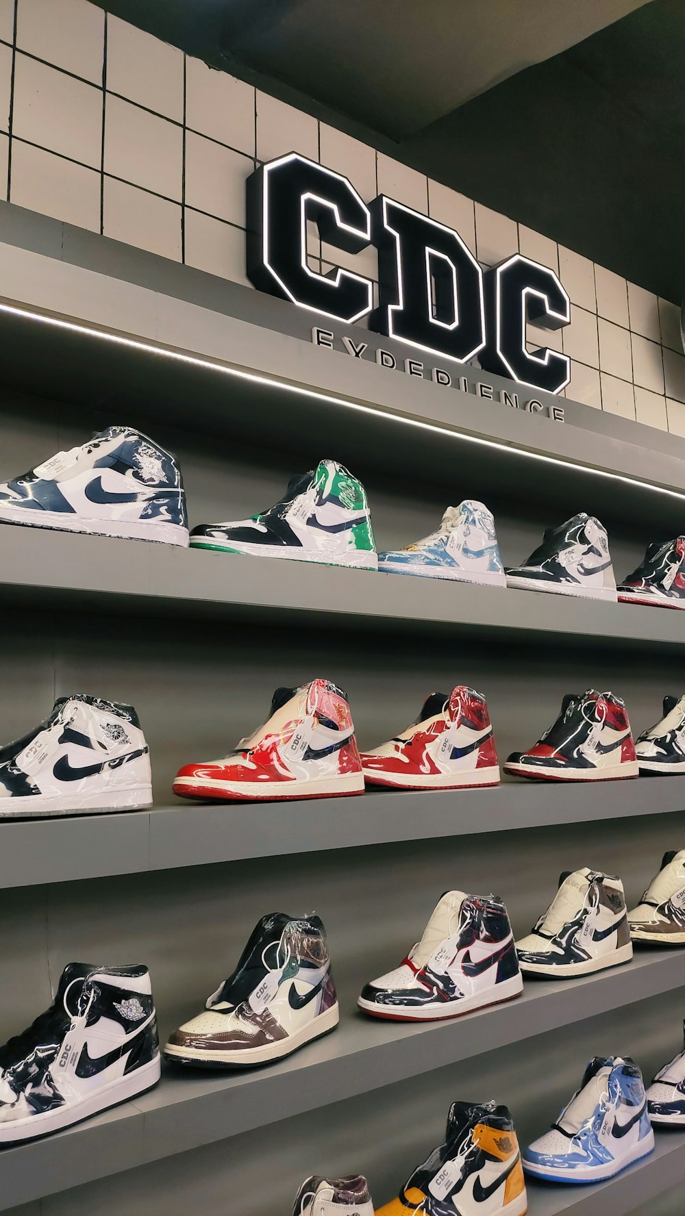 a row of shelves filled with different types of shoes