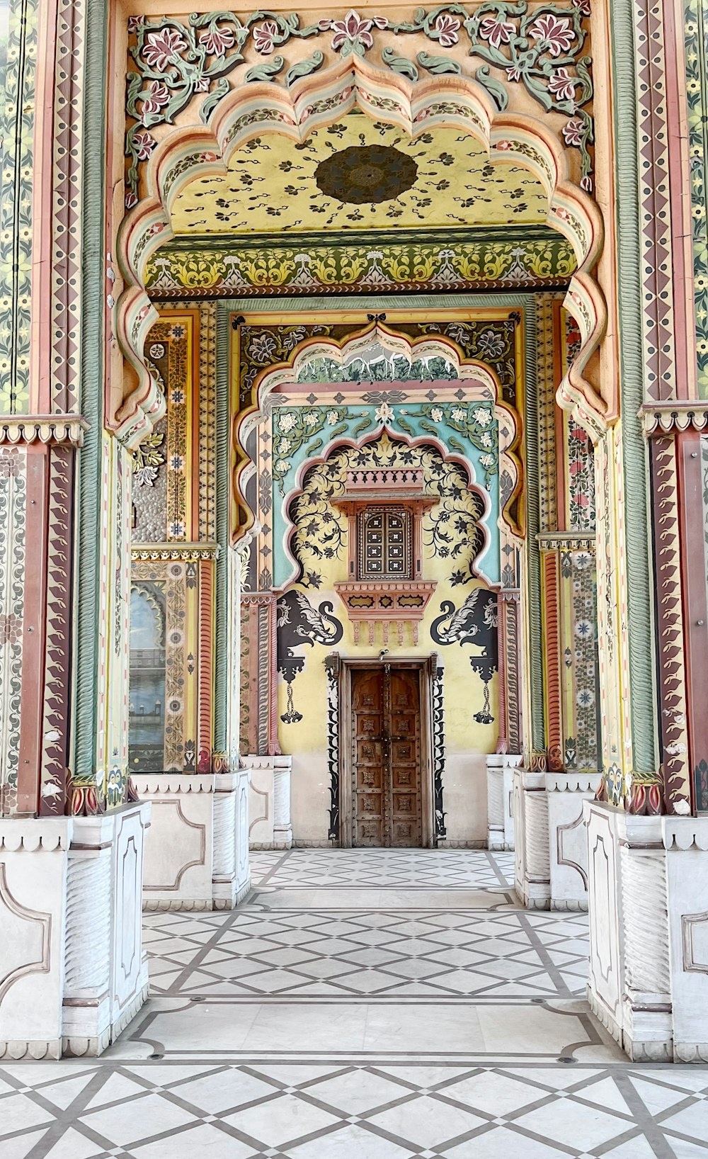 a large building with a doorway and a tiled floor