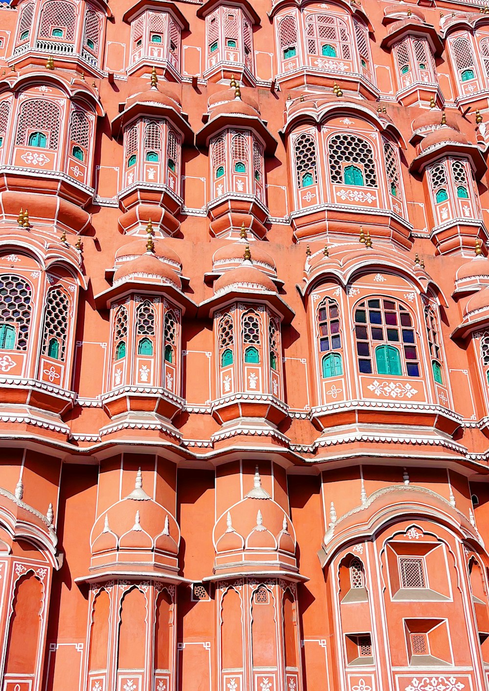 a very tall building with many windows and balconies