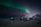 Couple watching northern lights in Murmansk with warm clothing