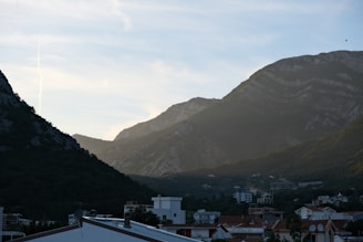 a view of a city with mountains in the background