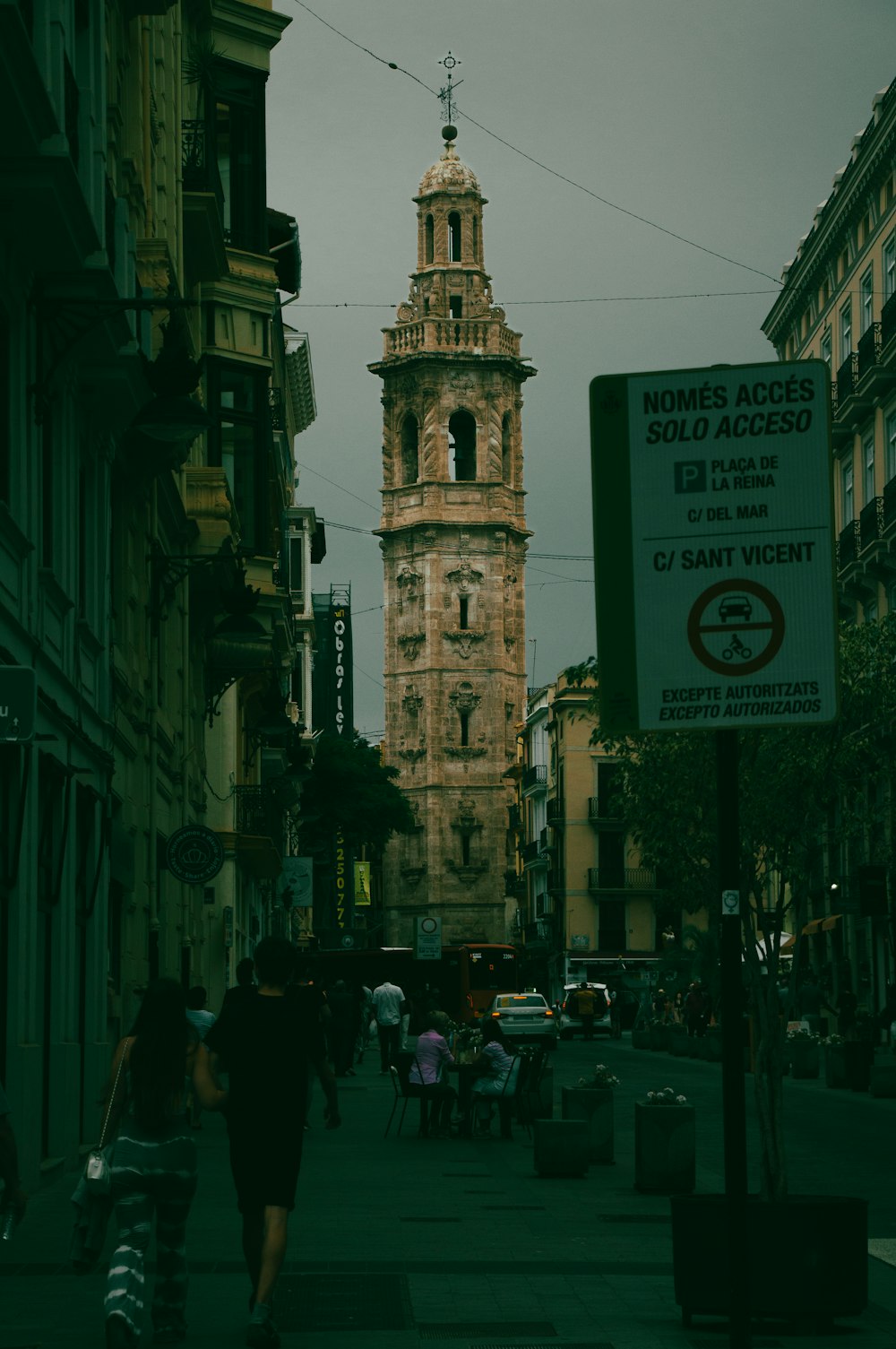 a tall clock tower towering over a city street
