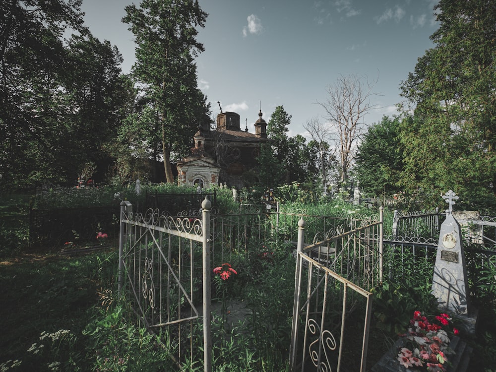 a cemetery with a cemetery gate and a cemetery in the background