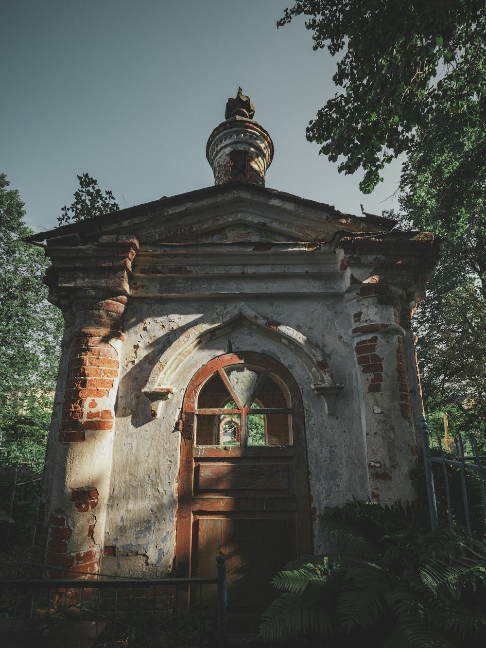 an old building with a door and a tower