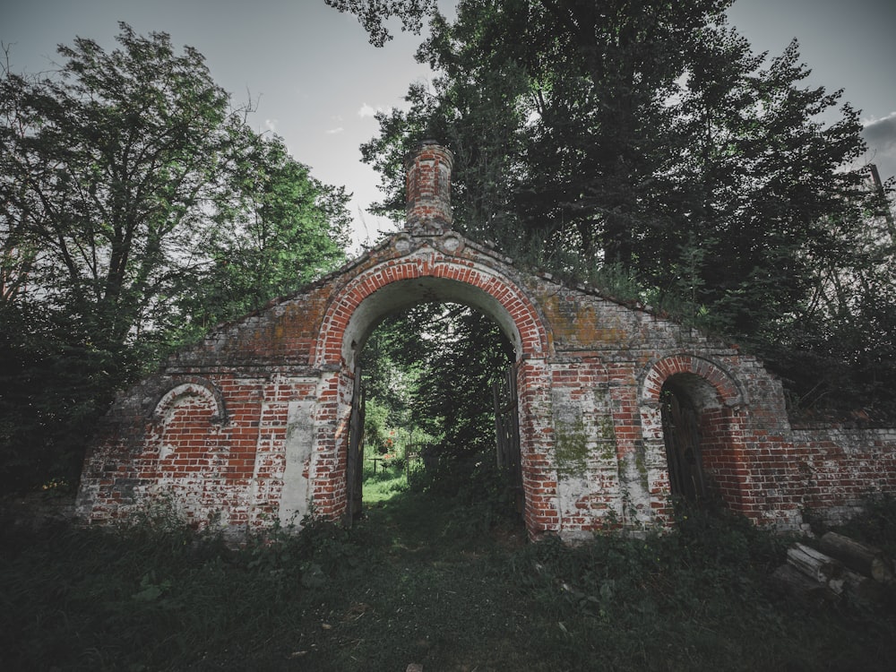 an old brick building with an arched doorway