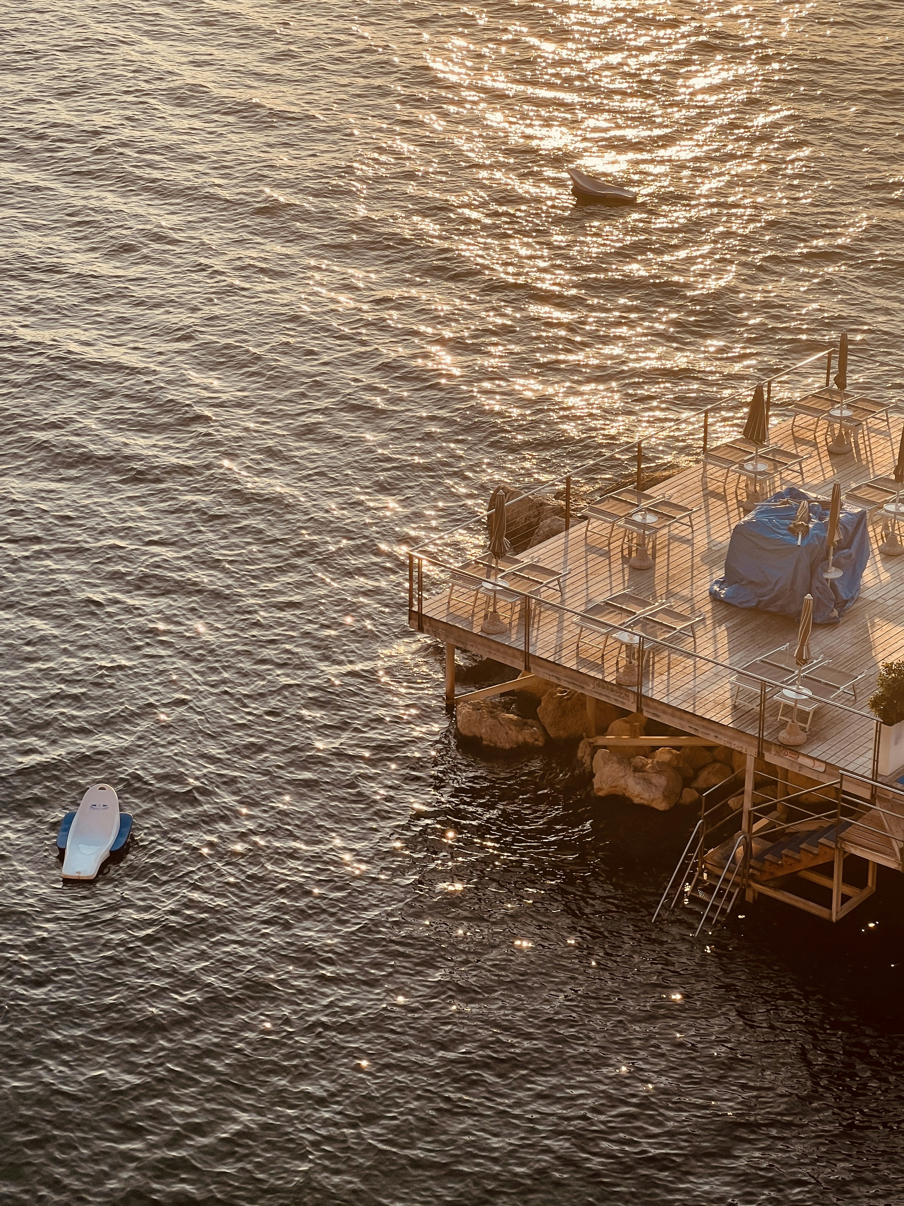 a boat floating on top of a large body of water