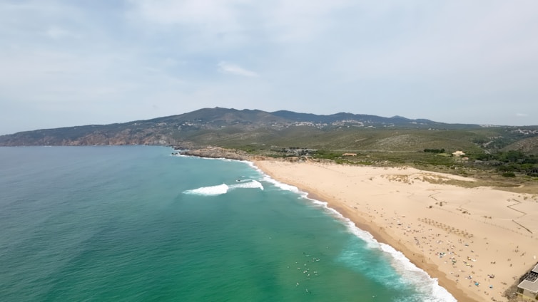 A breathtaking view of a Hawaiian beach with turquoise waters and golden sand.