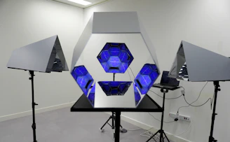 A full-length interactive magic mirror with guests taking photos and a visible touchscreen interface.