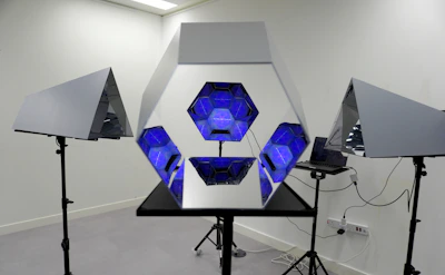 A full-length interactive magic mirror with guests taking photos and a visible touchscreen interface.