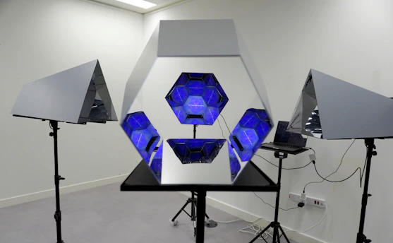 A full-length interactive magic mirror with guests taking photos and a visible touchscreen.