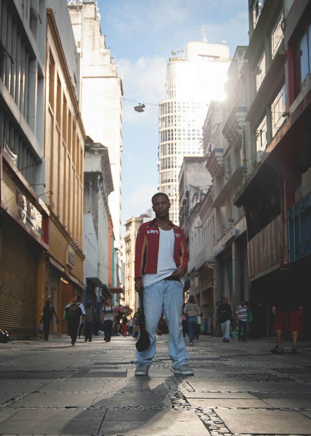 a man standing in the middle of a city street