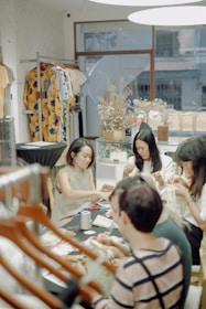 a group of people sitting around a table